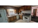 Functional kitchen design with ample cabinet space and standard appliances at 2572 Tyler Way, Decatur, GA 30032