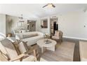 Cozy living room with comfortable furniture, a stylish rug, and an open floor plan to the kitchen at 700 Park Regency Ne Pl # 803, Atlanta, GA 30326