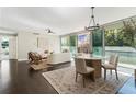 Airy living room featuring a dining area, large windows, and sophisticated decor at 700 Park Regency Ne Pl # 803, Atlanta, GA 30326