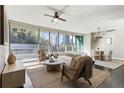 Modern living room with city views, stylish furniture, and plenty of natural light at 700 Park Regency Ne Pl # 803, Atlanta, GA 30326