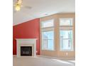 Living room featuring a fireplace, neutral paint, carpet, and bright natural light at 4531 Flowering Br, Powder Springs, GA 30127