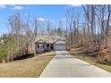 Lovely brick home boasts a two-car garage and long driveway at 197 Saddleridge Dr, Bremen, GA 30110