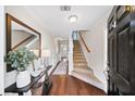 Bright entryway with hardwood floors and staircase leading to the upper level at 3540 Chattahoochee Summit Se Ln # 28, Atlanta, GA 30339