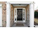 Inviting front entrance with classic black door and decorative sidelights at 3540 Chattahoochee Summit Se Ln # 28, Atlanta, GA 30339