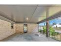 Spacious carport with brick columns and concrete floor, offering covered parking at 9258 Westview Sw Dr, Covington, GA 30014