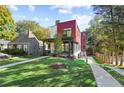 A modern home boasts a covered porch, brick accents, and a spacious, well-manicured lawn at 1171 State St # B, Atlanta, GA 30318