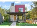 Modern two-story home featuring brick accents, a covered porch, and a well-manicured lawn at 1171 State St # B, Atlanta, GA 30318