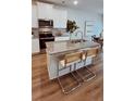 An open-concept kitchen with granite countertops and stainless steel appliances at 4274 Notting Hill Dr # 24, Atlanta, GA 30331