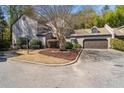 Inviting townhome with lush landscaping, including a mature tree and manicured bushes at 2914 Lenox Ne Rd # 12, Atlanta, GA 30324