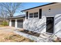 Lovely home with a two-car garage and a welcoming front entrance, showcasing suburban charm at 6650 Baldwin Ct, Riverdale, GA 30274