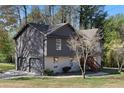 View of home with a two-car garage and combination siding and painted brick exterior at 3427 Saddleton Way, Douglasville, GA 30134