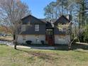 Charming two-story home with a combination of siding and painted brick exterior and inviting front entrance at 3427 Saddleton Way, Douglasville, GA 30134