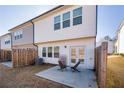 Cozy backyard with a small patio and two chairs, perfect for relaxation at 1042 Edwin Ln, Sugar Hill, GA 30518