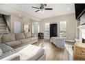 Bright living room with hardwood floors, neutral walls, and plenty of natural light at 2275 Holly Run Dr, Jonesboro, GA 30236