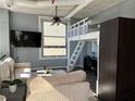 Comfortable living room featuring ample natural light, a ceiling fan, and flexible furniture at 20 Marietta Nw St # 10E, Atlanta, GA 30303