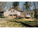 View of the home showcasing the two-car garage and side entry at 494 Rue Montaigne, Stone Mountain, GA 30083