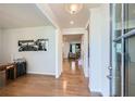 Bright foyer with hardwood floors leads into an open concept living area, with art on the wall at 115 Laurelwood Ln, Dallas, GA 30157