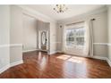 Hardwood floors in the entryway with decorative molding and a window at 2404 Caneridge, Marietta, GA 30064