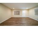 Bright living room with wood-look flooring and natural light from large windows at 3645 Larkspur Ter, Decatur, GA 30032
