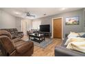 Spacious living room with neutral gray walls, a ceiling fan, and multiple sofas at 3501 Roswell Ne Rd, Atlanta, GA 30305