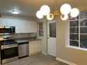 Modern kitchen with stainless steel appliances, granite countertops, and stylish white cabinetry at 1148 Briarcliff Ne Rd # 1, Atlanta, GA 30306