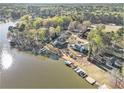 Breathtaking aerial view of lakefront homes with private docks, surrounded by vibrant trees at 2220 Emerald Dr, Jonesboro, GA 30236