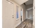 Inviting entryway boasting wood-look flooring, neutral paint, and vaulted ceiling at 3111 Fairington Dr, Lithonia, GA 30038