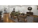 Spacious living room featuring hardwood floors and an open layout for seamless entertaining and living at 360 Peyton Sw Rd, Atlanta, GA 30311