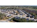 Aerial view of the neighborhood with the house's location marked; this community has well-maintained landscaping at 130 Brayden Park Dr, Canton, GA 30115