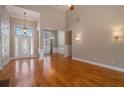 Sunlit living room featuring soaring ceilings and hardwood floors at 160 Glenmore Ln, Mcdonough, GA 30253