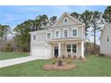 Beautiful two-story home with a well-kept lawn, attached garage, and classic design elements at 254 Arnewood Cir, Mcdonough, GA 30253