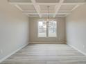 Bright dining room with decorative ceiling and a stylish chandelier at 138 Crabbswood Dr, Mcdonough, GA 30253