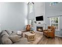 Cozy living room with a fireplace, soaring ceilings, and lots of natural light at 2360 Brookgreen Commons, Kennesaw, GA 30144