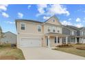 Inviting two-story home with a two-car garage and nicely landscaped front yard at 537 Teversham Dr, Mcdonough, GA 30253