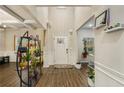 Bright foyer features beautiful wood flooring, wainscotting and a soaring ceiling at 224 Osier Dr, Mcdonough, GA 30252