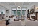 Bright living room with fireplace, recessed lights, and stylish furniture, perfect for relaxing or entertaining guests at 821 Camden Park Ct, Atlanta, GA 30342