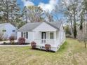Well-maintained house featuring a lovely porch and fresh landscaping at 1991 Mcafee Pl, Decatur, GA 30032