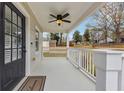 Inviting front porch with an overhead ceiling fan and view of the front yard at 1991 Mcafee Pl, Decatur, GA 30032