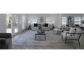Spacious living room bathed in sunlight, featuring contemporary furniture, chic decor, and seamless access to an outdoor deck at 2041 Briarcliff Ne Rd, Atlanta, GA 30329