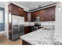 Charming kitchen featuring stainless steel appliances, granite counters, and plentiful cabinet space for storage and functionality at 3371 Dogwood Dr # 220, Hapeville, GA 30354