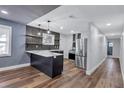 Bright kitchen with modern appliances, beautiful countertops, and wood-look flooring at 1328 Sharon Street Nw, Atlanta, GA 30314