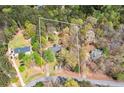 Aerial view of the property highlighting the home's location in a wooded area at 195 Creekside Way, Mcdonough, GA 30252