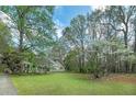 A well maintained lawn and landscape surrounds this one story house at 195 Creekside Way, Mcdonough, GA 30252