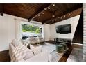 Stylish living room with hardwood floors, large window, modern furniture, and views of the front yard at 3473 Regalwoods Dr, Atlanta, GA 30340