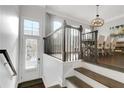 Bright entryway with hardwood floors, stairs to dining area and ample natural light at 4121 Townsend Ln, Atlanta, GA 30346