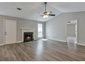 Bright living room with hardwood floors, fireplace, and fresh neutral paint at 2220 Golden Valley Dr, Lawrenceville, GA 30043