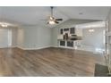 Spacious living area with hardwood floors, fireplace, and kitchen view at 2220 Golden Valley Dr, Lawrenceville, GA 30043