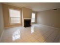 Bright living room with fireplace flanked by windows is perfect for gatherings and relaxation at 37 Le Parc Fontaine, Lithonia, GA 30038