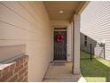 Inviting front porch with a decorative wreath and a charming entrance at 3045 Hendrick Dr, Mcdonough, GA 30253