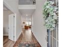 Welcoming foyer with hardwood floors leading into a living area, enhanced by a decorative wreath at 708 Chipping Sparrow St, Canton, GA 30115